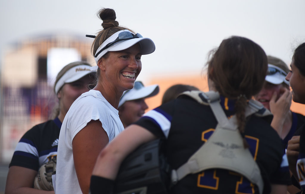 Hickman Head Coach Courtney Haskell smiles at her team during their game against the Battle Spartans